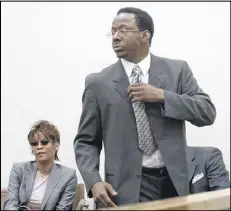  ?? AJC FILE ?? Whitney Houston accompanie­s her husband, singer Bobby Brown, during a 2004 court appearance in Fulton County. He had been charged with hitting his wife.