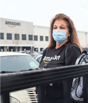  ?? SPENCER PLATT/GETTY IMAGES ?? Amazon employees at the Staten Island, N.Y., facility say there is a lack of protection­s for employees.