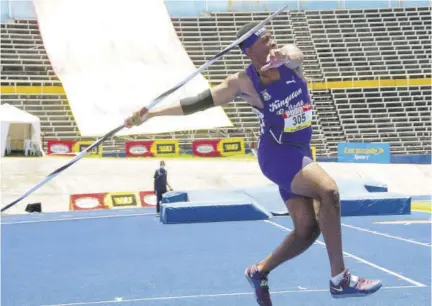  ??  ?? Akeel Hanchard of Kingston College prepares to throw the javelin 62.93m to win the Open category yesterday.