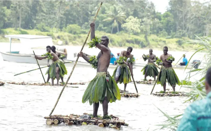  ?? Photo: Vilimoni Vaganalau ?? Some villagers from Naganivatu in Naitasiri on their bamboo rafts on November 2, 2017 travelling down the Rewa River to Syria Park in Nausori for the Rewa Festival. They left the village at around 5am.