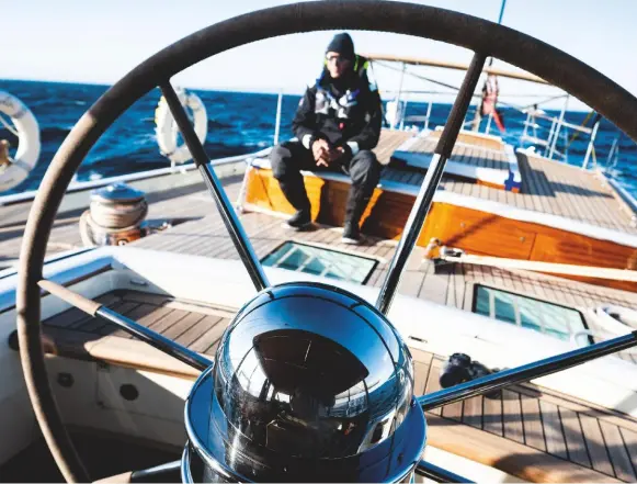  ??  ?? Skipper and author Michael van Bregt stands watch on the aft deck