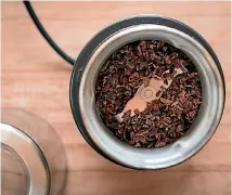  ??  ?? Grind the cacao nibs in a spice or coffee grinder.