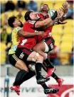  ?? GETTY IMAGES ?? Matt Proctor, Matt Todd and Seta Tamanivalu go up for the high ball at Westpac Stadium.