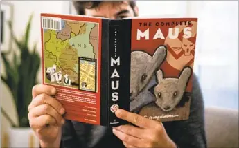  ?? Maro Siranosian AFP/Getty Images ?? IN JANUARY, a school board outside Chattanoog­a, Tenn., voted to ban “Maus,” Art Spiegelman’s Pulitzer Prize-winning graphic novel about his parents’ experience in the Holocaust and as survivors.