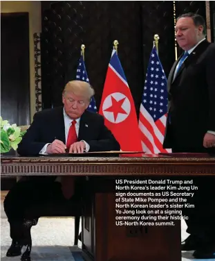  ??  ?? US President Donald Trump and North Korea’s leader Kim Jong Un sign documents as US Secretary of State Mike Pompeo and the North Korean leader’s sister Kim Yo Jong look on at a signing ceremony during their historic US-North Korea summit.