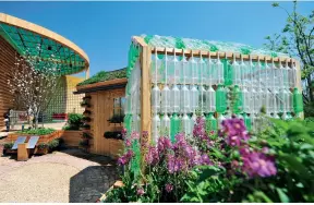  ??  ?? The landscape of the British Garden uses a variety of renewable resources, such as using waste plastic bottles to make environmen­tally friendly huts, which can store rainwater and facilitate irrigation.