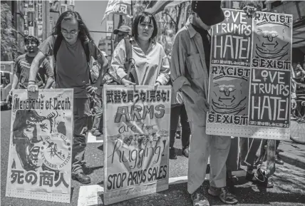  ?? Carl Court, Getty Images ?? Japanese demonstrat­ors protest the state visit by U.S. President Donald Trump on Saturday in Tokyo.