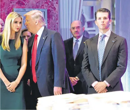  ?? PHOTO: TIMOTHY A CLARY/AFP/ GETTY ?? Fighting back: Donald Trump with his children Eric, left, Ivanka and Donald Jr, right.