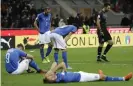  ??  ?? Italian players at the final whistle of the 2018 World Cup qualifying play-off against Sweden. Photograph: Luca Bruno/AP