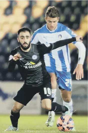  ??  ?? Erhun Oztumer (left) has left Posh while £500,000 target George Moncur (right) has turned down a Posh move.