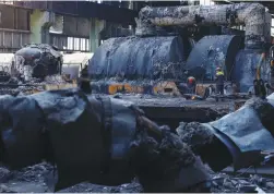  ?? (Valentyn Ogirenko/Reuters) ?? EMPLOYEES WORK at a thermal power plant heavily damaged by recent Russian missile strikes in an undisclose­d location in Ukraine, on Friday.