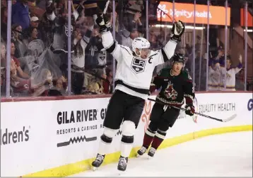  ?? CHRISTIAN PETERSEN — GETTY IMAGES ?? The Kings' Anze Kopitar celebrates after scoring a goal against the Coyotes during the third period of Friday's game.