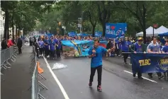  ?? (Shimon Mercer Wood) ?? CELEBRANTS MARCH in the Celebrate Israel Parade on Fifth Avenue in Manhattan yesterday, alongside Central Park.