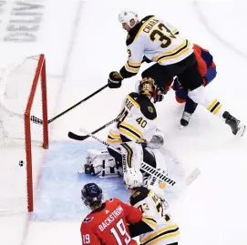  ??  ?? TOUGH END TO THE FIRST PERIOD: Washington’s T.J. Oshie took the puck away from Zdeno Chara and slipped in the open goal in the final seconds of the first period. Below, Jake DeBrusk got the Bruins on the board in the third period of Sunday’s 2-1 loss to the Capitals.