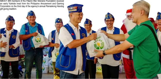  ??  ?? ABOUT 300 members of the Filipino War Veterans Foundation received an early Yuletide treat from the Philippine Amusement and Gaming Corporatio­n on the third day of the agency’s annual Pamaskong Handog gift-giving tradition.