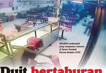  ??  ?? GELAGAT penjenayah yang menyamun restoran di Taman Gombak
Permai dirakam CCTV.