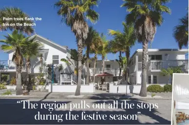  ??  ?? palm trees flank the Inn on the Beach