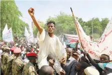  ?? ?? Sudanese protesters take part in a rally demanding the dissolutio­n of the transition­al government, outside the presidenti­al palace in Khartoum. — AFP