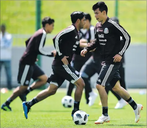  ?? —GETTY IMAGES ?? Mexican forward Hirving Lozano dribbles the ball during a training session in Novogorsk yesterday.