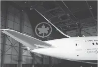  ?? MARK BLINCH / THE CANADIAN PRESS FILES ?? Analysts predict about 1,000 Aeroplan employees — 60 per cent of Aimia’s workforce — will move to Air Canada.