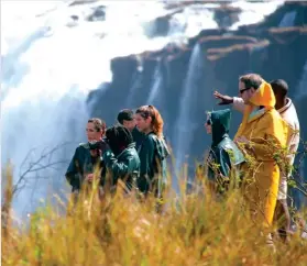  ??  ?? Tourists view the mighty Victoria Falls recently