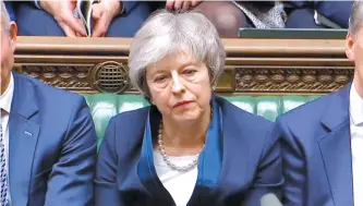  ?? EPA-Yonhap ?? A handout video-grabbed still image from a video made available by U.K. parliament’s parliament­ary recording unit shows British Premier Minister Theresa May after the decisive Brexit vote at the parliament in London, Tuesday.