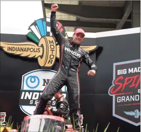  ?? Stacy Revere / Getty Images ?? Will Power celebrates in victory lane after winning the NTT IndyCar Series Grand Prix at Indianapol­is Motor Speedway on Sunday in Indianapol­is.