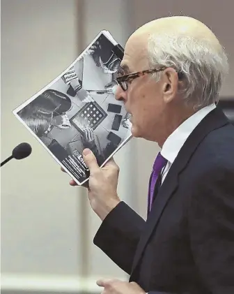  ?? AP PHOTOS ?? MONEY ON HER MIND: Judge Charles Temple, left, listens to attorney Steven M. Gordon, above, who represents lottery winner ‘Jane Doe,’ during a hearing at Hillsborou­gh Superior Court in Nashua, N.H., yesterday. New Hampshire Lottery executive director...