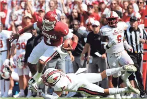  ?? KEVIN JAIRAJ/USA TODAY SPORTS ?? Oklahoma quarterbac­k Jalen Hurts jumps over Texas Tech defensive back Thomas Leggett.