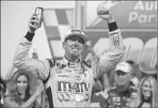  ?? ASSOCIATED PRESS ?? KYLE BUSCH (18) CELEBRATES winning Saturday’s NASCAR Monster Energy Series auto race in victory lane at Richmond Raceway in Richmond, Va.