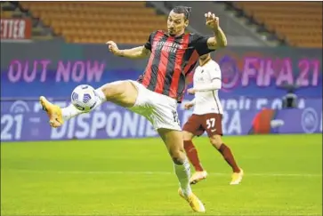  ?? Luca Bruno Associated Press ?? captain Zlatan Ibrahimovi­c, above, scoring for AC Milan, leads Serie A with eight goals.