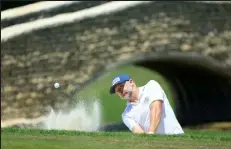  ?? Sam Greenwood / Getty Images ?? David Skinns of England, a 40-year-old tour rookie, plays his shot from a bunker on the 18th hole during the second round of the Byron Nelson. Skinns was in a three-player tie for first.
