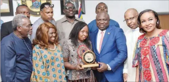  ??  ?? Lagos State Governor, Mr. Akinwunmi Ambode presenting a State Plaque to the President, Africa Movie Academy Awards (AMAA), Peace Anyiam-Osigwe during the AMAA delegation courtesy visit to the Governor at the Lagos House, Ikeja, on Thursday, March 23,...