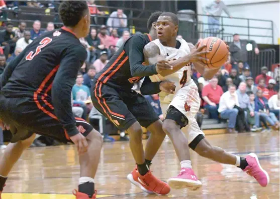  ?? | WORSOM ROBINSON/ FOR THE SUN- TIMES ?? Guard Jordan Booker scored 29 points to lead Bogan past St. Rita on Tuesday. The Bengals will face rival Morgan Park in the sectional final.