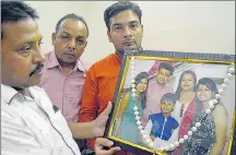  ??  ?? Rakesh Gupta of Ludhiana showing a photo of his brother and his family, who were killed in an accident on October 18, 2016. A total of 549 accidents were reported in the city last year killing 384 people. HT FILE