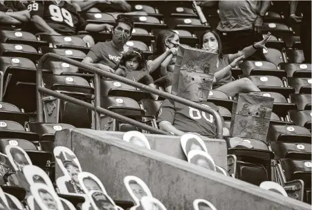  ?? Jon Shapley / Staff photograph­er ?? For the first time this season, Texans fans watch the team at NRG Stadium on Sunday, with social distancing and limited capacity.