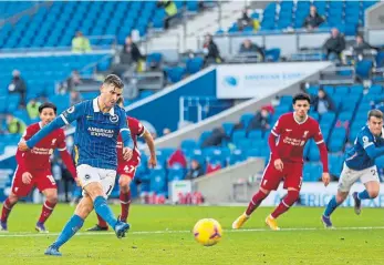  ??  ?? Brighton’s Pascal Gross grabs a point from the penalty spot in injury time