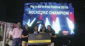  ??  ?? The Rockaoke champion and winner of two tickets to London with Ambassador Pruce and representa­tives from Etihad Airways