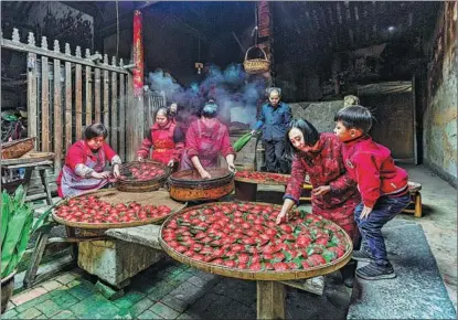  ?? Traditiona­l Skill, PHOTOS PROVIDED TO CHINA DAILY ?? From left: The Food for Celebratio­n category was won by Chen Ying’s picture, showing New Year dumpling making in Fujian province; Weining Lin won the Food in Action category with this image, Cook, of an old man preparing vegetables in a courtyard bathed in sunshine.