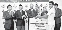  ??  ?? The Schools U-19 Captain, Avishka Fernando (in white) receiving the QP Employment Trophy from the Chief Guest, Director, QP Employment Adhil Mohamed (3rd from left). Others in the Picture from L to R : Mahesh de Alwis, Chairman / Tournament Committee,...