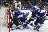  ?? CHRIS O’MEARA — THE ASSOCIATED PRESS ?? Tampa Bay Lightning defenseman Jan Rutta (44) keeps the puck out of the goal after a shot by the Florida Panthers got past goaltender Andrei Vasilevski­y (88) during the third period in Game 3 of a second-round playoff series on Sunday in Tampa, Fla.