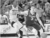  ?? RON IRBY/ASSOCIATED PRESS ?? Arkansas’s Dusty Hannahs dribbles past the defense of Florida’s Keith Stone during the first half on Wednesday.