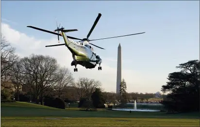  ?? EVAN VUCCI — THE ASSOCIATED PRESS ?? Marine One, with President Donald Trump and first lady Melania Trump aboard, lifts off the South Lawn of the White House, Wednesday, Dec. 23, in Washington, enroute to Andrews Air Force Base and then onto Florida.
