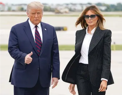  ?? MANDEL NGAN/GETTY IMAGES ?? President Donald Trump and first lady Melania Trump step off Air Force One in Cleveland on Sept. 29.