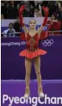  ?? DAVID J. PHILLIP — ASSOCIATED PRESS ?? Alina Zagitova celebrates on the podium after winning the gold medal.