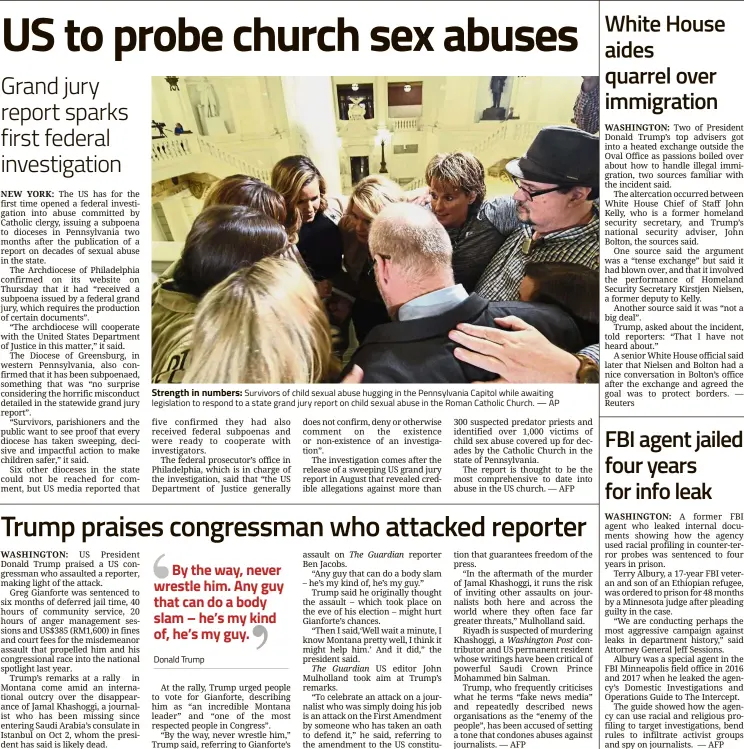  ?? — AP ?? Strength in numbers: Survivors of child sexual abuse hugging in the Pennsylvan­ia Capitol while awaiting legislatio­n to respond to a state grand jury report on child sexual abuse in the Roman Catholic Church.