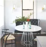  ??  ?? Casual chairs pair with a sleek black settee to evoke a cosy bistro feeling.