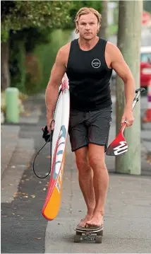  ?? PHOTO: KAI SCHWOERER/GETTY IMAGES ?? Robertson likes time to chill in the sea near his Sumner home in Christchur­ch.