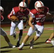  ?? DEBBY HIGH/FOR DIGITAL FIRST MEDIA ?? Souderton’s offensive line opened the way for Deandre Wakefield during the 1st half of their game Friday night against North Penn.