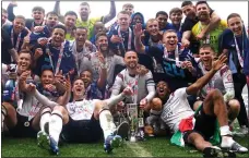  ?? ?? RAM-PANT: Derby’s delighted squad celebrate winning promotion